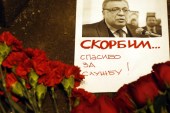 Flowers lie near a picture of Russia's ambassador to Turkey Andrey Karlov, outside the Russian foreign ministry in Moscow on December 19 [EPA]