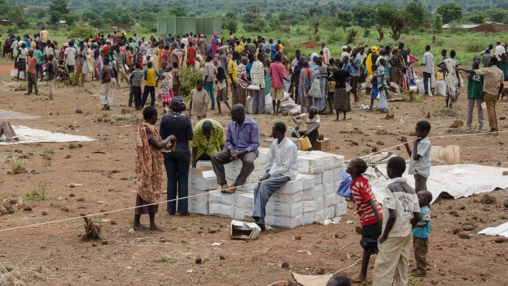 Aid delivery to internally displaced at UNMISS base, Wau [Richard Nield/Al Jazeera]