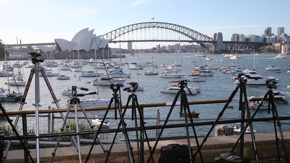 
Spectators tripods are lined up at Lady Macquarie's Chair ready for the annual New Years Eve fireworks display [AP Photo/Rob Griffith]
