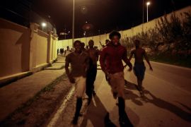 African migrants run on a road after crossing the border fence between Morocco and Spain''s north African enclave of Ceuta