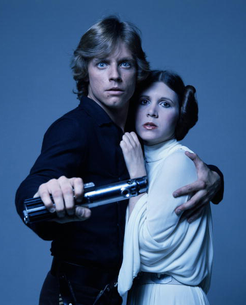 Mark Hamill and Carrie Fisher in costume as brother and sister Luke Skywalker and Princess Leia [Getty]