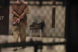 A detainee paces around a cell block while being held in Joint Task Force Guantanamo''s Camp VI at the U.S. Naval Base in Guantanamo Bay, Cuba