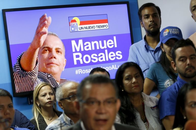 An image of former Venezuelan presidential candidate Rosales is displayed on a television screen during a news conference by Un Nuevo Tiempo party leaders at its headquarters in Caracas
