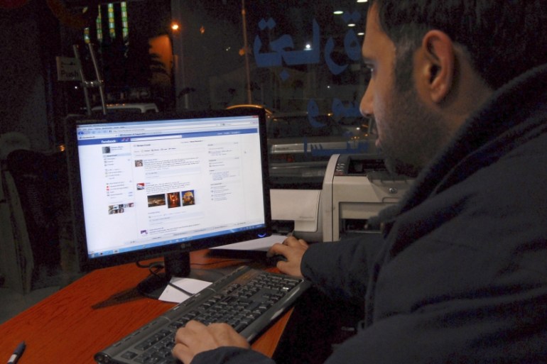A Syrian man connects on his Facebook account