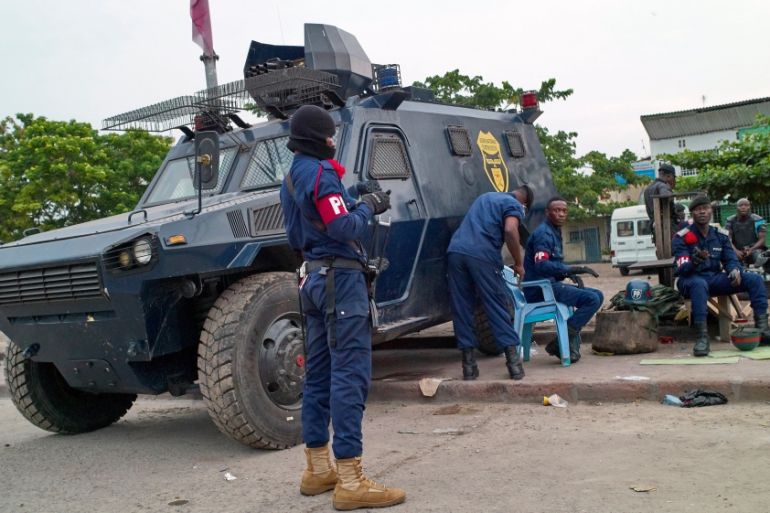 Congolese riot policemen take a break during demonstrations against President Joseph Kabila in Lingwala Municipality of the Democratic Republic of Congo''s capital Kinshasa