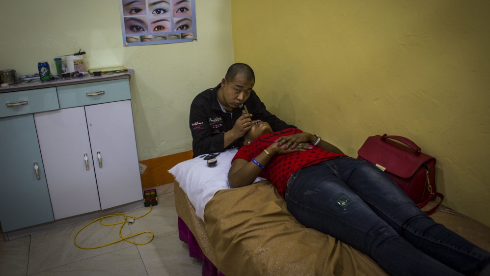 A tattoo and beauty centre in Kinshasa [Francesca Volpi/Al Jazeera]