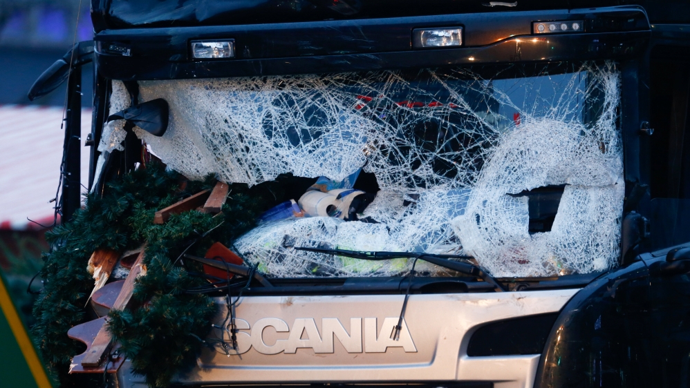 
A damaged windscreen of a lorry that slammed into a crowd at a Christmas market on Breitscheidplatz square near the fashionable Kurfuerstendamm avenue [Reuters]
