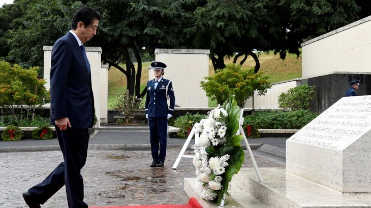 Japanese PM Abe presents a wreath at National Memorial Cemetery of the Pacific at Punchbowl in Honolulu, Hawaii