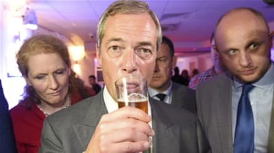 Nigel Farage is fond of being photographed with a pint of beer or cigarette in hand [Toby Melville/Reuters]