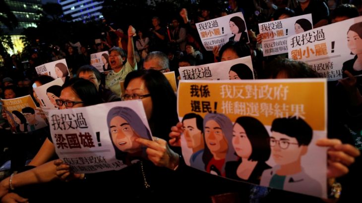 Pro-democracy supporters take part in a rally against government decision to commence separate legal proceedings against four legislators over oaths taken at a Legislative Council, in Hong Kong, China