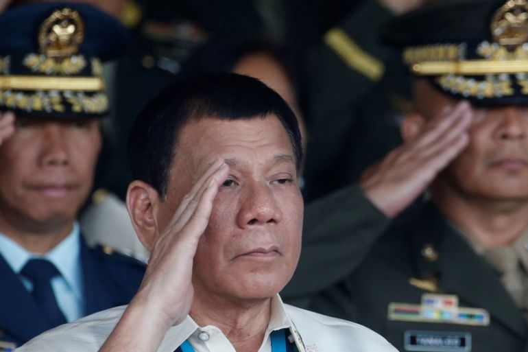 Philippine President Rodrigo Duterte salutes in Quezon city
