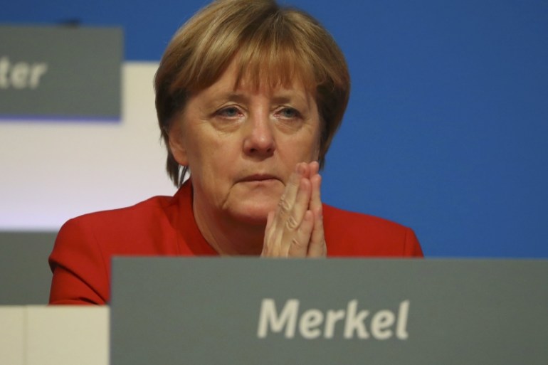 German Chancellor and leader of the conservative CDU Merkel is pictured at the CDU party convention in Essen