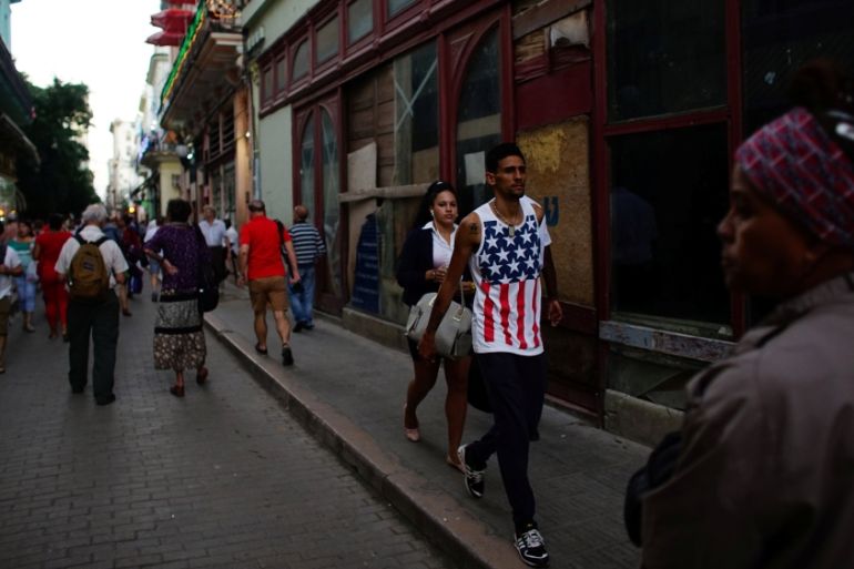 A man wearing the U.S. colours walks in downtown Havana, Cuba