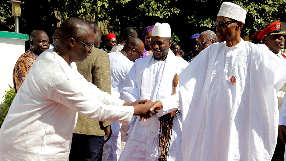 Nigerian President Muhammadu Buhari, right, has appealed to Jammeh, centre, to step down twice in person without success [AFP]