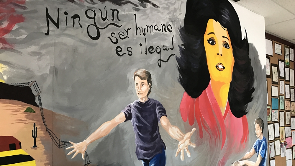 Casa de Migrantes is a migrant shelter on the Mexican side of the border in Juarez. The mural reads, 'No human being is illegal' [Sophie Eastaugh/Al Jazeera] 