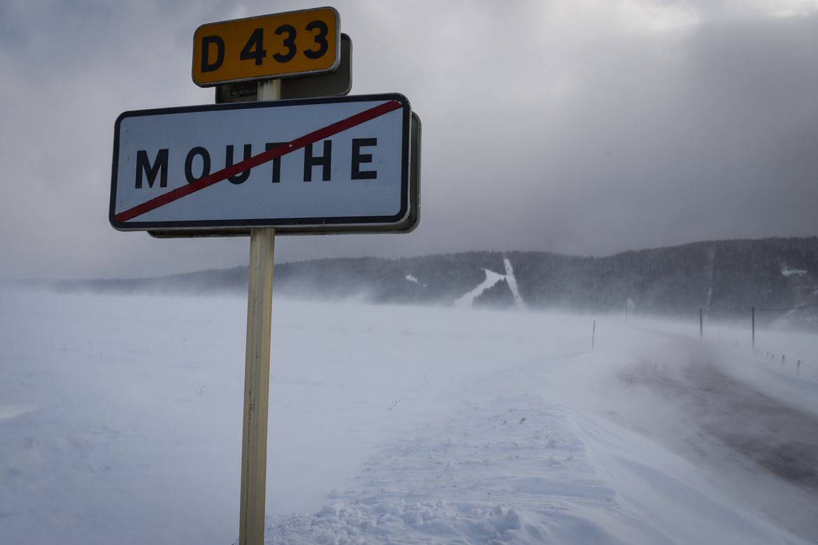 Snow making drifts on the roads near the French city of Mouthe, France
