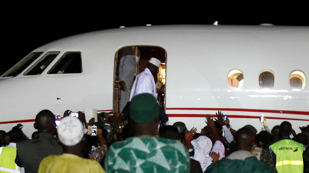 Former Gambian President Yahya Jammeh boards a plane at a Banjul airport as he flies into exile from The Gambia [Thierry Gouegnon/Reuters]