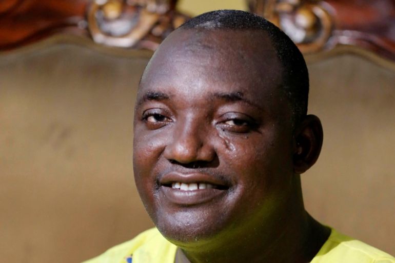 The new president of Gambia, Adama Barrow poses for a picture at his home in Yarambamba, West Coast Region, Gambia