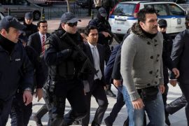 The eight Turkish soldiers, who fled to Greece in a helicopter and requested political asylum after a failed military coup against the government, are escorted by police of