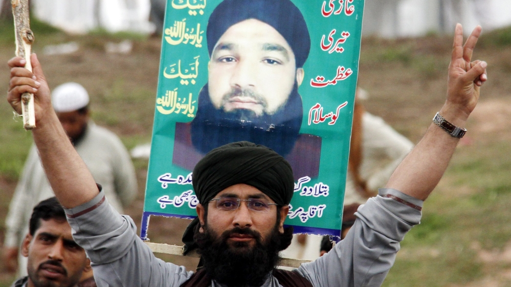 Thousands of supporters of Mumtaz Qadri came out on the streets after he was hanged for killing Taseer [EPA]