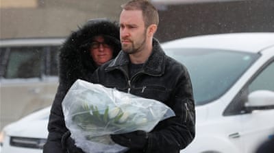 People bring flowers to the shooting scene [Reuters]
