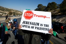 Palestinian demonstrator holds placard during a protest against a promise by U.S. President-elect Donald Trump to re-locate U.S. embassy to Jerusalem, in t