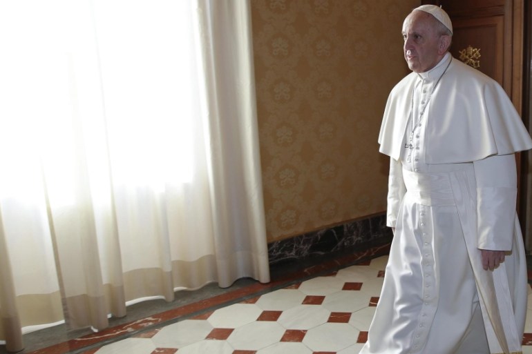 Pope Francis walks to meet Paraguayan President Cartes