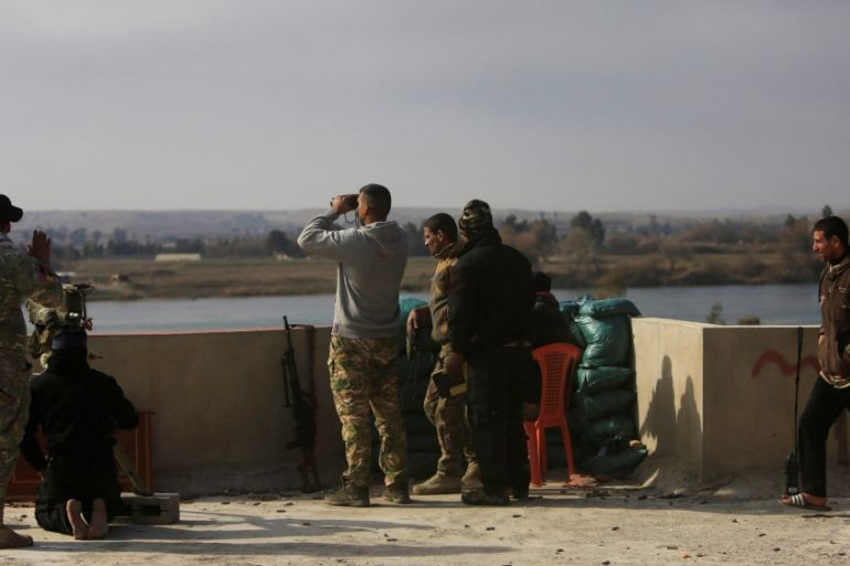 Iraqi rapid response forces take positions near Tigris river, during a battle with Islamic State militants, in Mosul
