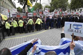 Demonstrators protest outside Downing Street in London