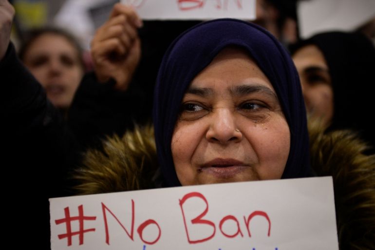 A Muslim women holds a sign during anti-Donald Trump travel ban protests outside Philadelphia International Airport in Philadelphia
