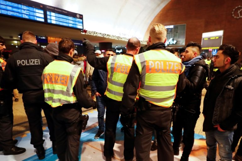 Police officers of Germany''s federal police Bundespolizei check young men at Cologne''s main railways station following New Year celebrations