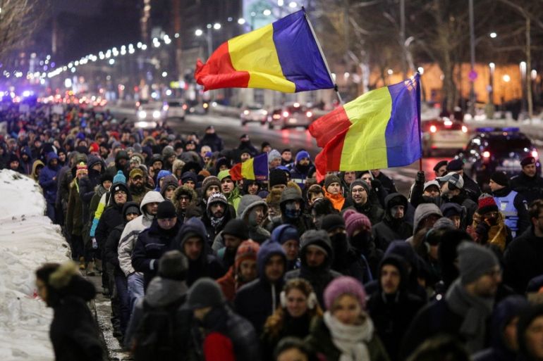 Romanians protest on a main boulevard against government plans to grant prison pardons and decriminalize some offences through emergency decree, in Bucharest