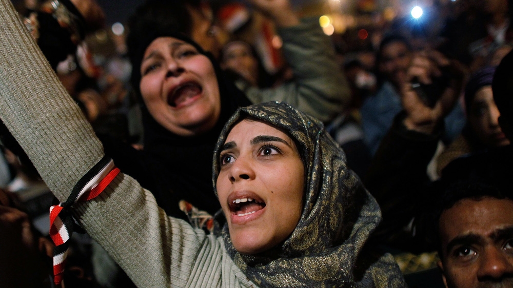 
A woman cheers in Tahrir Square after it was announced that Egyptian President Hosni Mubarak was giving up power February 11, 2011, in Cairo, Egypt [Chris Hondros/Getty Images]
