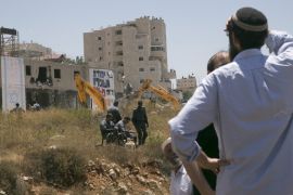 Jewish settlers watch demolition near Ramallah