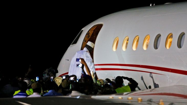 Former Gambian president Yahya Jammeh boards a private jet before departing Banjul into exile