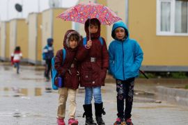 Syrian refugee children walk in Elbeyli refugee camp near the Turkish-Syrian border in Kilis province