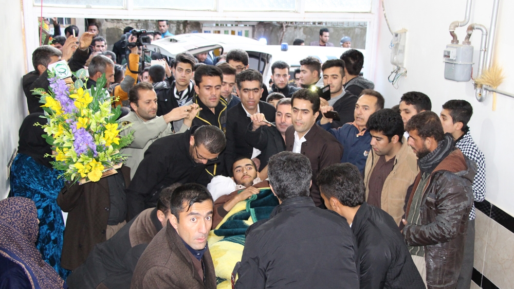Many residents came out to greet Bakhtar upon his arrival in his hometown [Dana Khormehr/Al Jazeera]