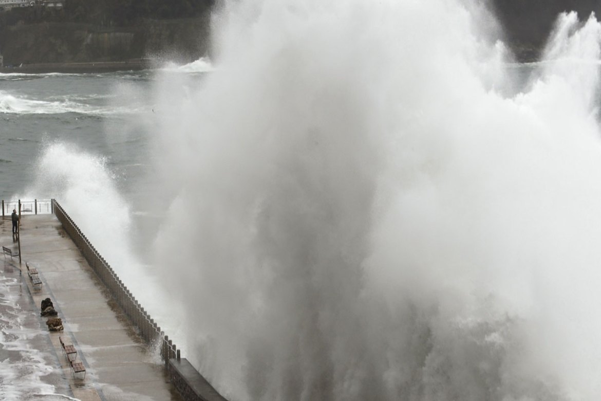 A big wave hits the Paseo Nuevo promenade in San Sebastian, Basque Country, northern Spain