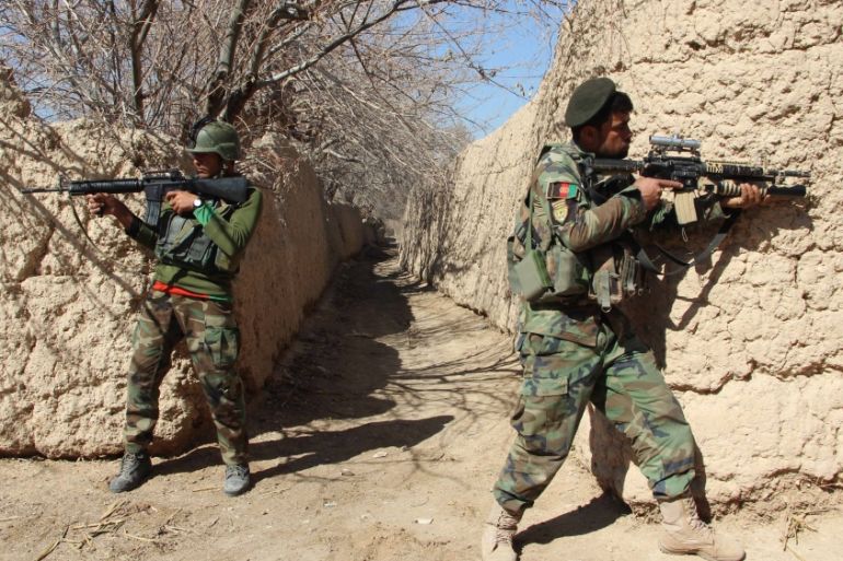 Afghan forces battle to save districts in Helmand