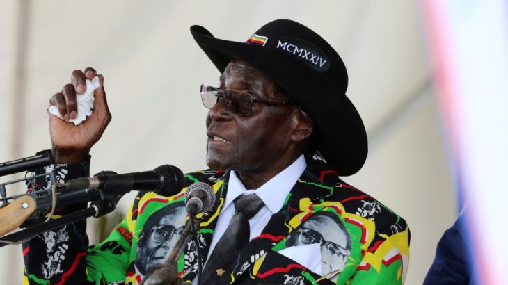 President Robert Mugabe speaks to supporters gathered to celebrate his 93rd birthday near Bulawayo