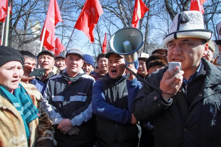 Supporters of detained opposition politician Omurbek Tekebayev, the leader of the Ata Meken (Fatherland) party, hold a rally in Bishkek, Kyrgyzstan