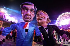 Figures of Francois Fillon and Marine Le Pen are paraded through the crowd during the 133rd Carnival parade, the first major event since the city was attacked during Bastille Day