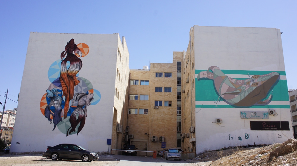 Using pastel colours, Attar drew a whale in Sweifieh to highlight environmental and water issues in Jordan [Zab Mustefa/Al Jazeera]
