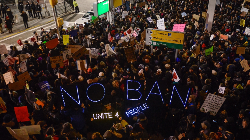Protesters rally during a demonstration against the Muslim immigration ban at John F Kennedy International Airport on January 28 in New York City [Stephanie Keith/Getty Images]