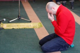 A man cries while he prays at the Quebec Islamic Cultural Centre in Quebec City