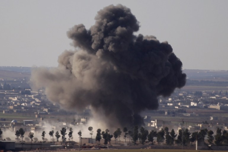 Smoke rises from the northern Syrian town of al-Bab