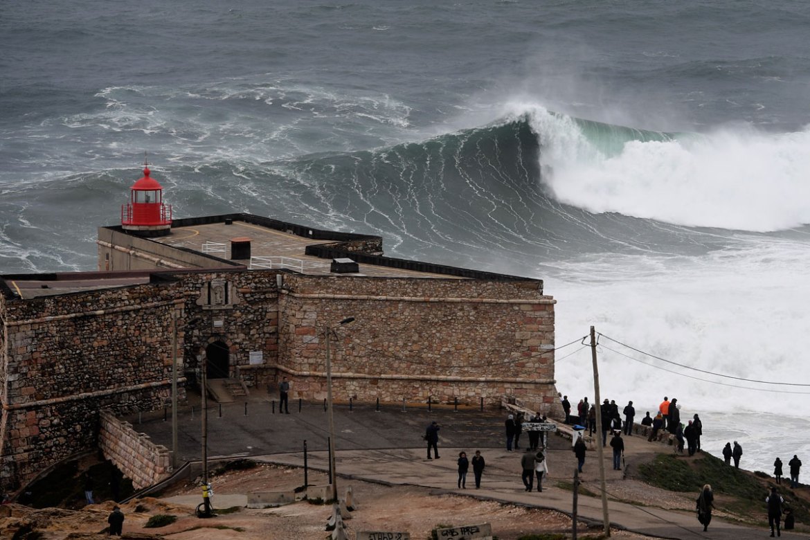 Waves approaching the Sao Miguel Arcanjo fort in Nazare, central Portugal.
