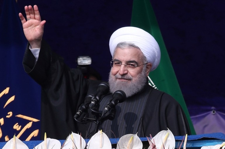 Iran''s President Hassan Rouhani waves during a ceremony marking the anniversary of Iran''s 1979 Islamic Revolution, in Tehran