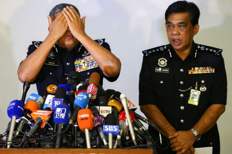 Khalid demonstrates during a news conference in Kuala Lumpur