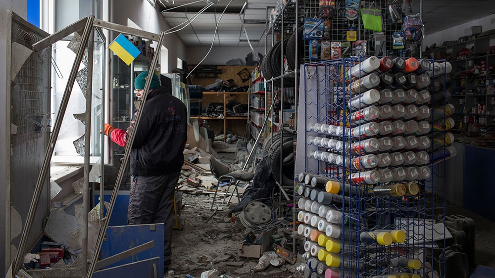 An auto supply store stands ruined after two mortars detonated on its roof near Old Avdiivka, a residential area of the town nearest the frontline [John Wendle/Al Jazeera]